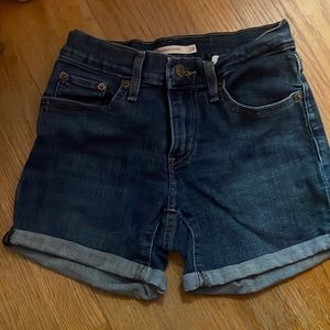 Levi mid length short. Dark denim wash